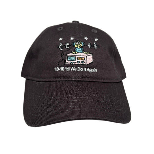 brown cap with embroidered design on a white surface