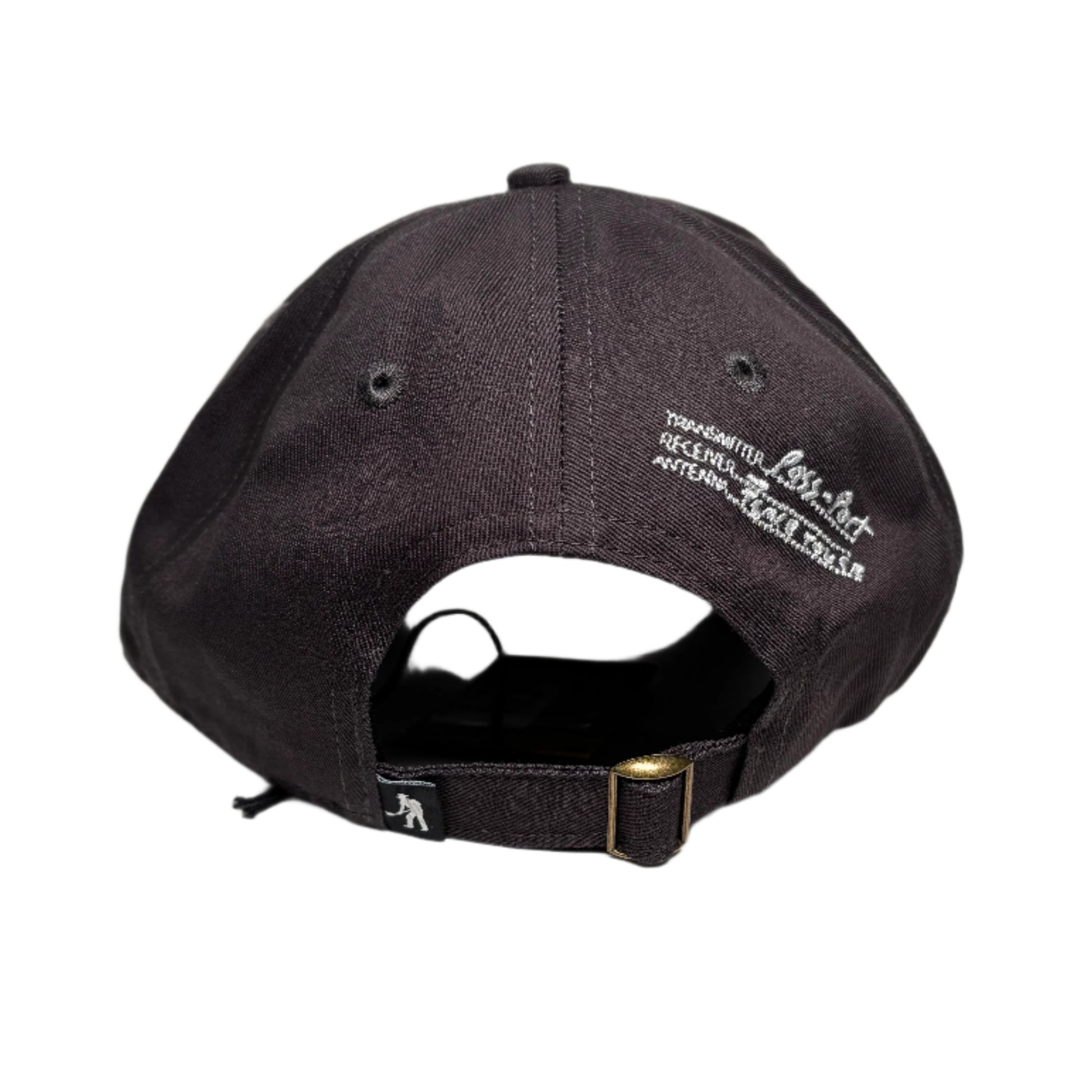 brown cap with white text on a gray surface