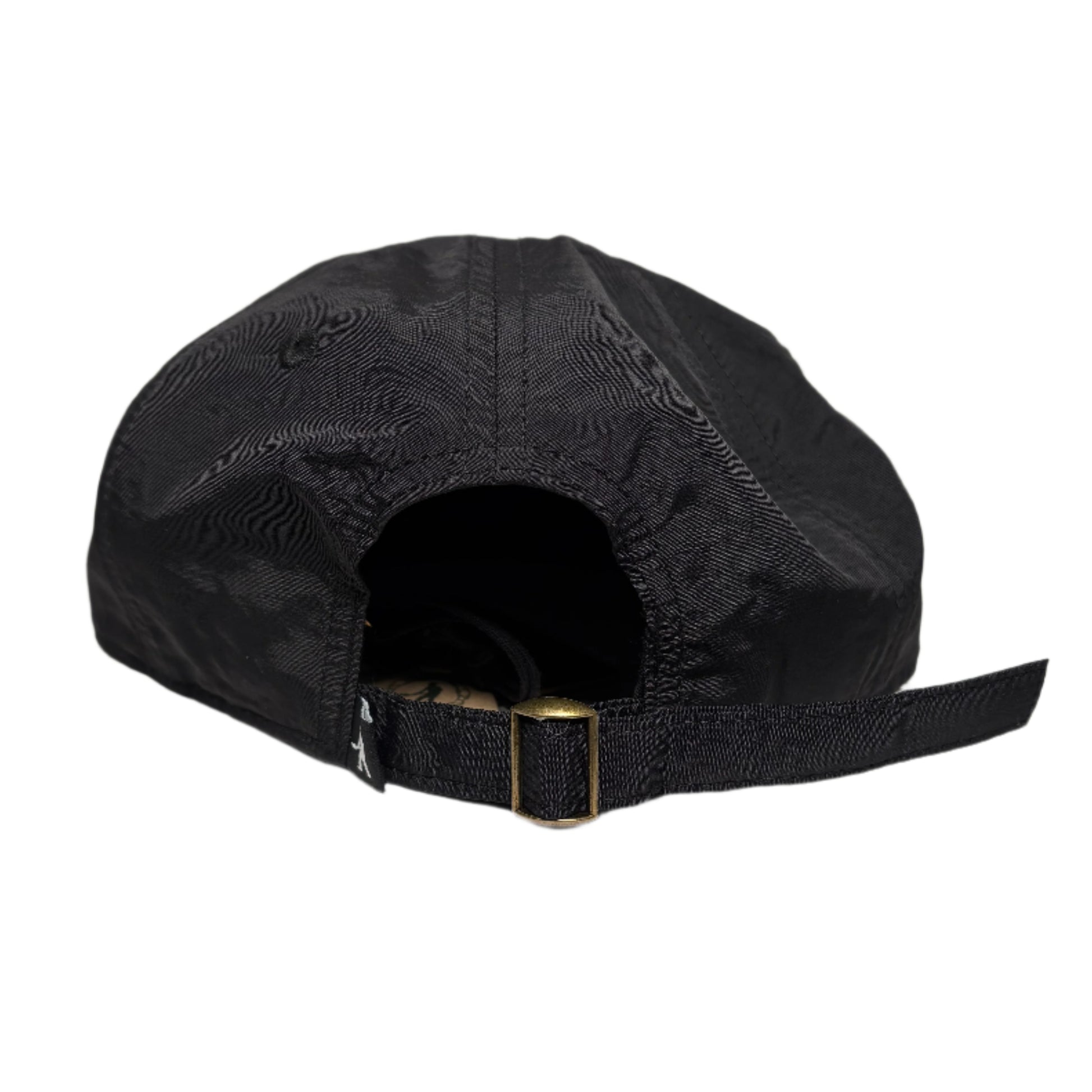 Black cap with a gold buckle on a white surface