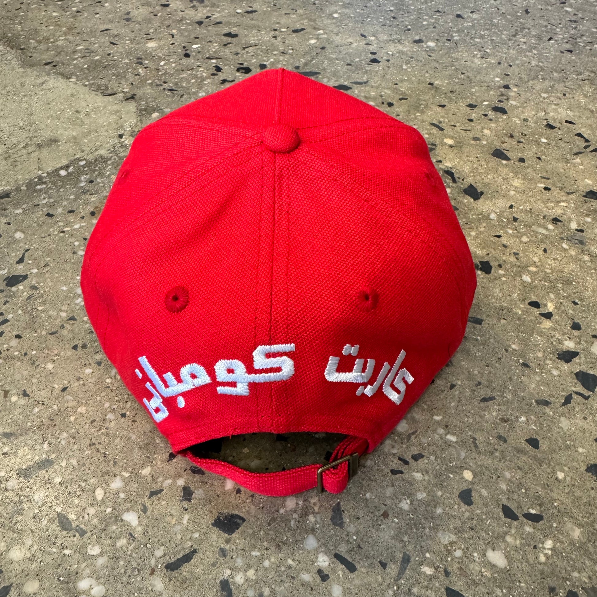 back of hat red with strap and white text