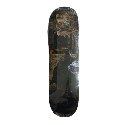 Skateboard deck with a black and gold design on a white background
