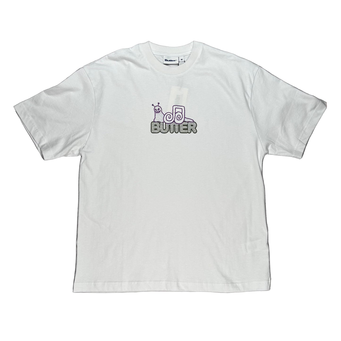 White t-shirt with a snail logo on a white surface