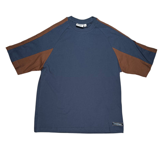Blue and brown shirt on a white surface