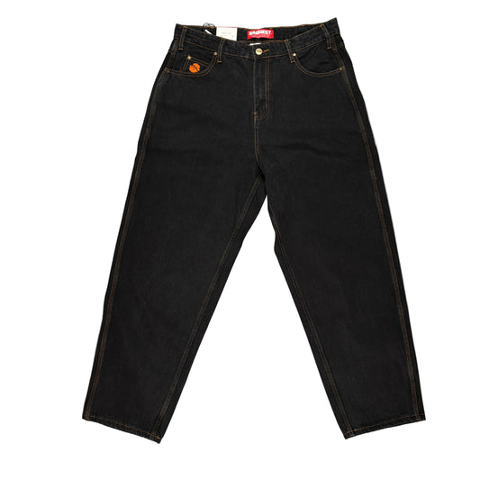 Black jeans with a brand logo on a white surface