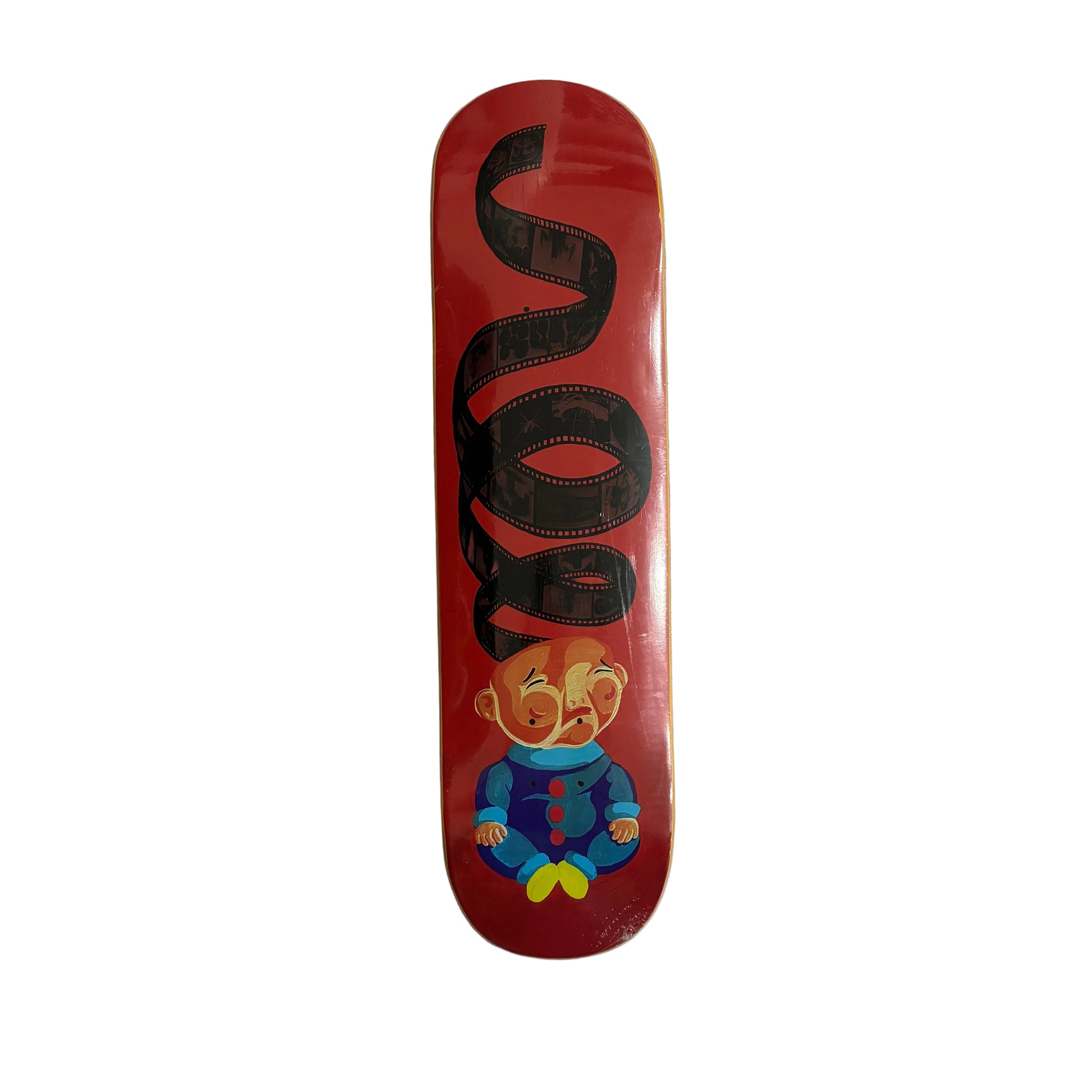 Skateboard deck with a cartoon character design on a white surface