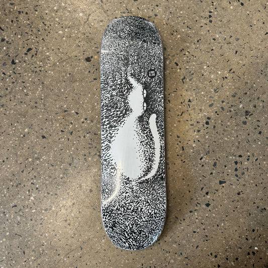 black and white speckle skateboard deck with a cat on it