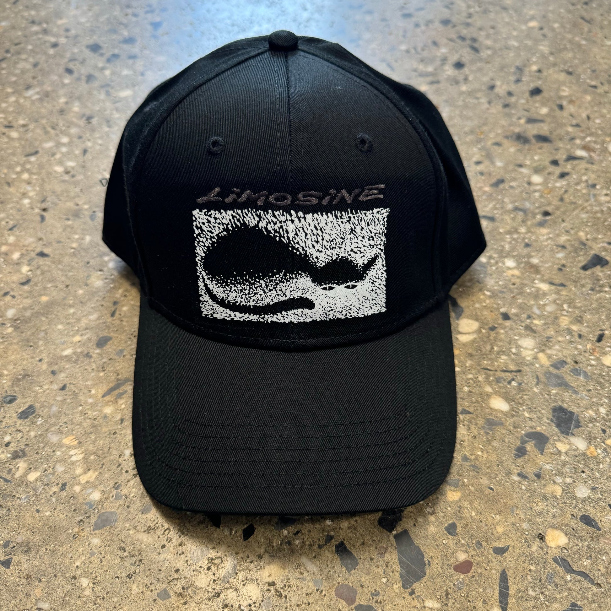 black hat with silver text and white graphic