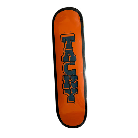 Orange skateboard deck with 'Tacky' logo on a gray surface