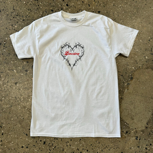 white t shirt with black heart outline in the center