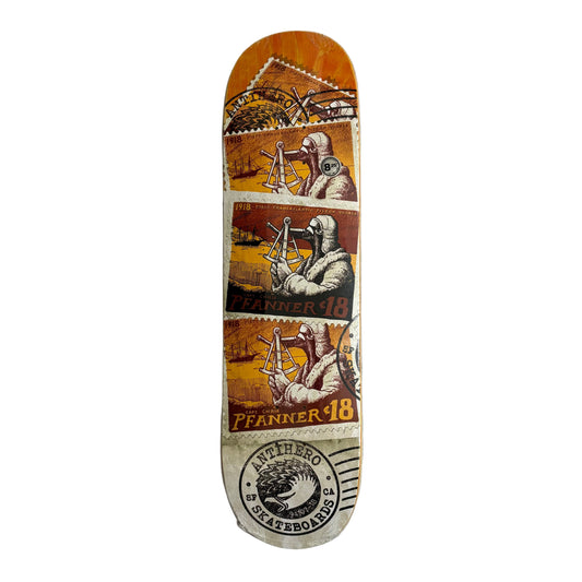 Skateboard deck with vintage-style graphics on a white surface