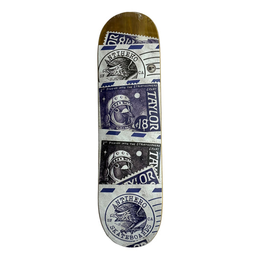 Skateboard deck with vintage-style graphics on a white surface