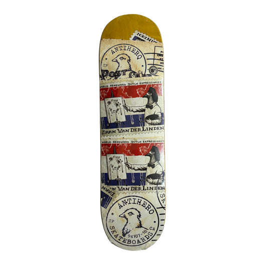 Skateboard deck with vintage-style graphics and text on a white surface