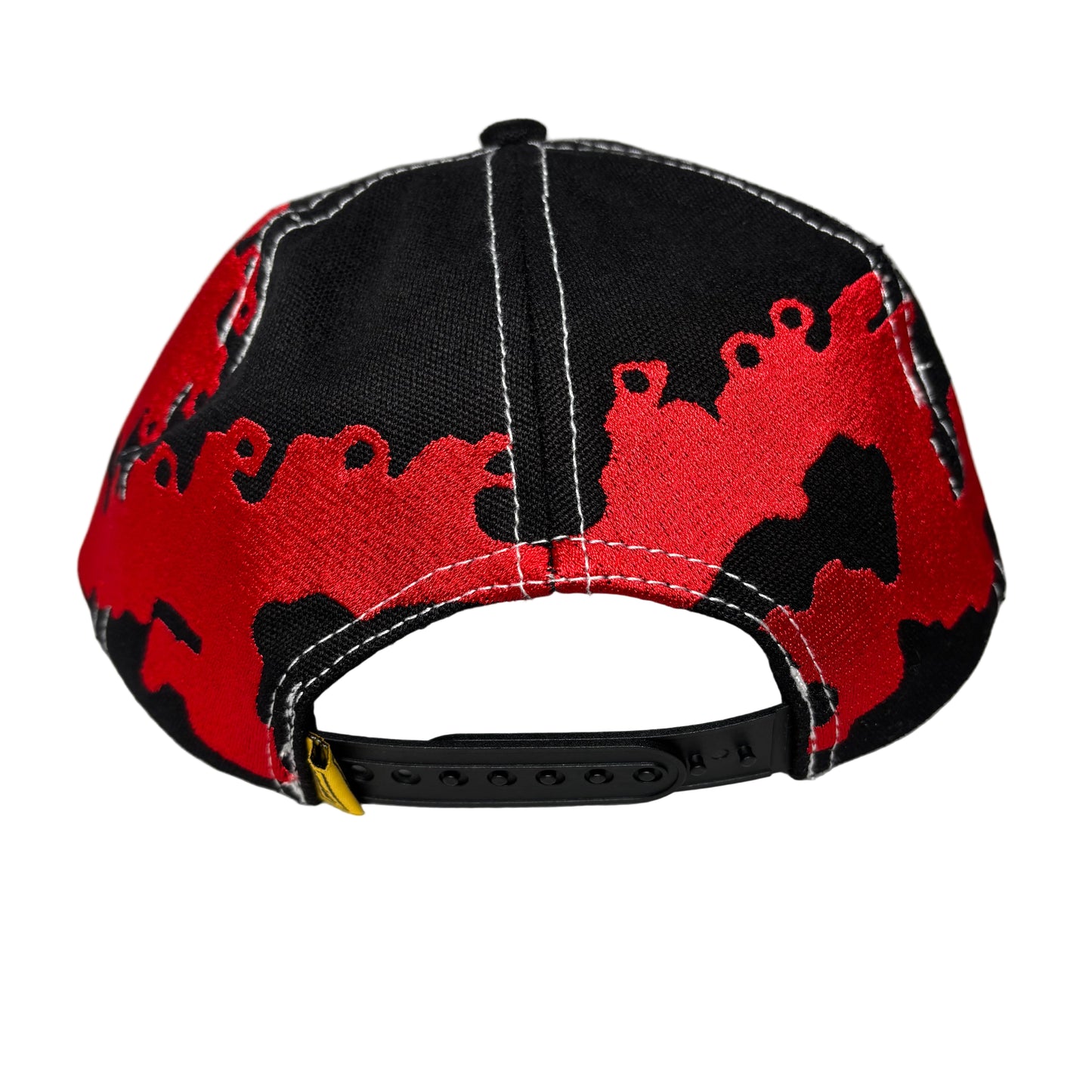 rear view of Red and black dragon cap on a white background