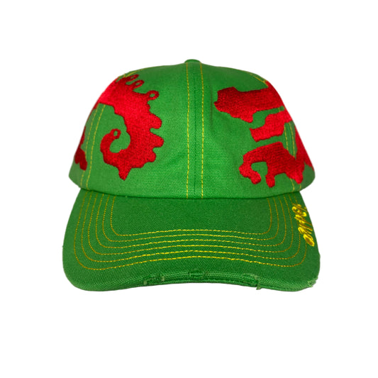 Green cap with red dragon designs on a white background