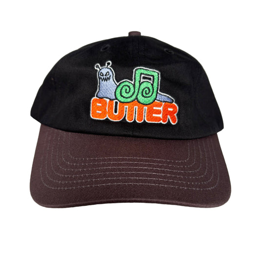 Black cap with brown brim with colorful snail logo on a white background