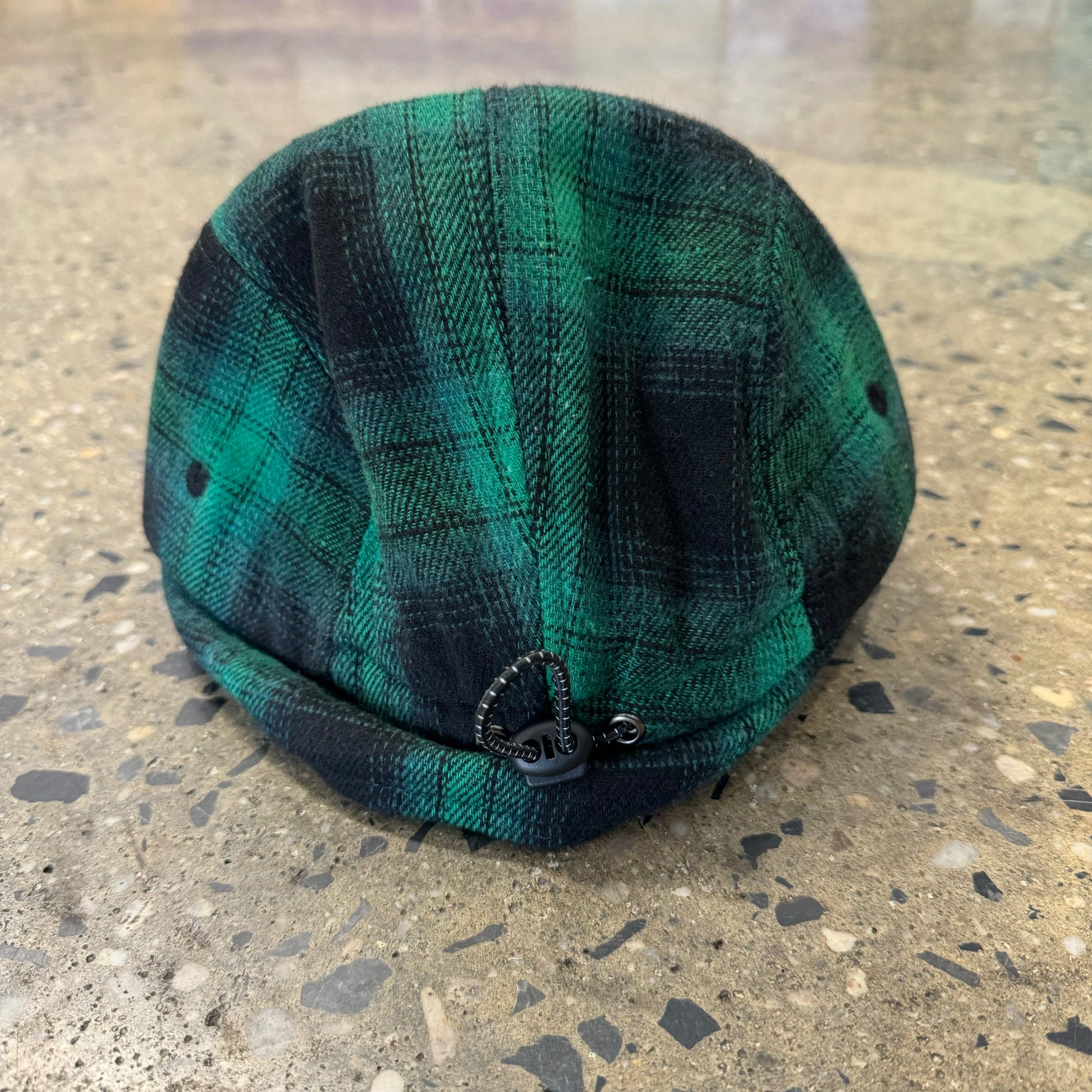 back view of green flannel hat