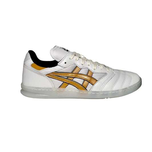 White sneaker with gold logo on a white background