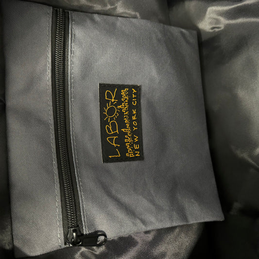 inside zip pocket, labor woven label