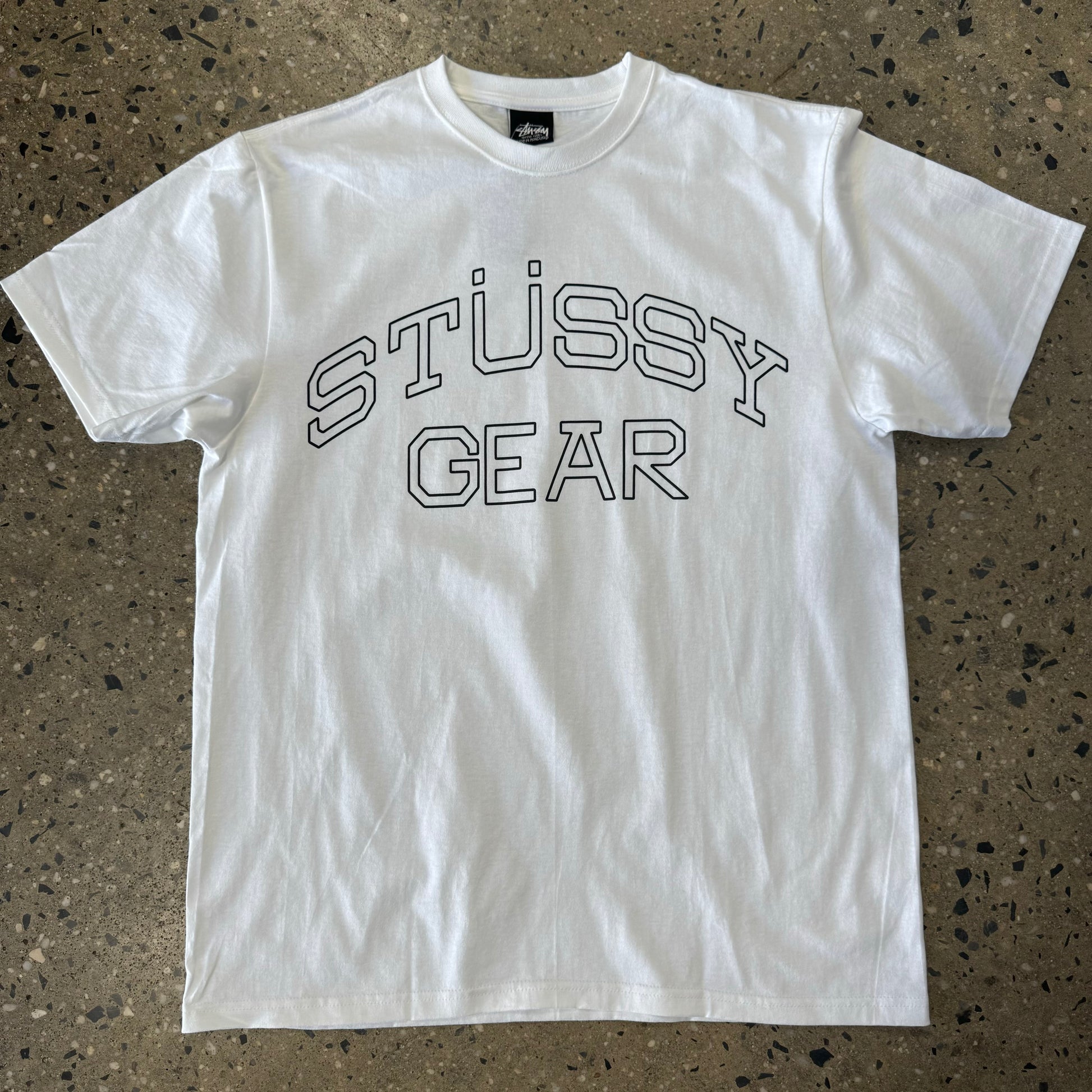 front view of STUSSY GEAR logo white t-shirt