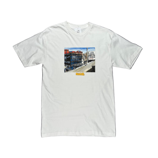 White t-shirt with a printed design on a white surface