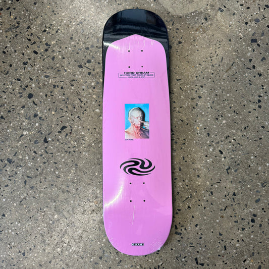 pink skateboard deck with small square graphic in the center