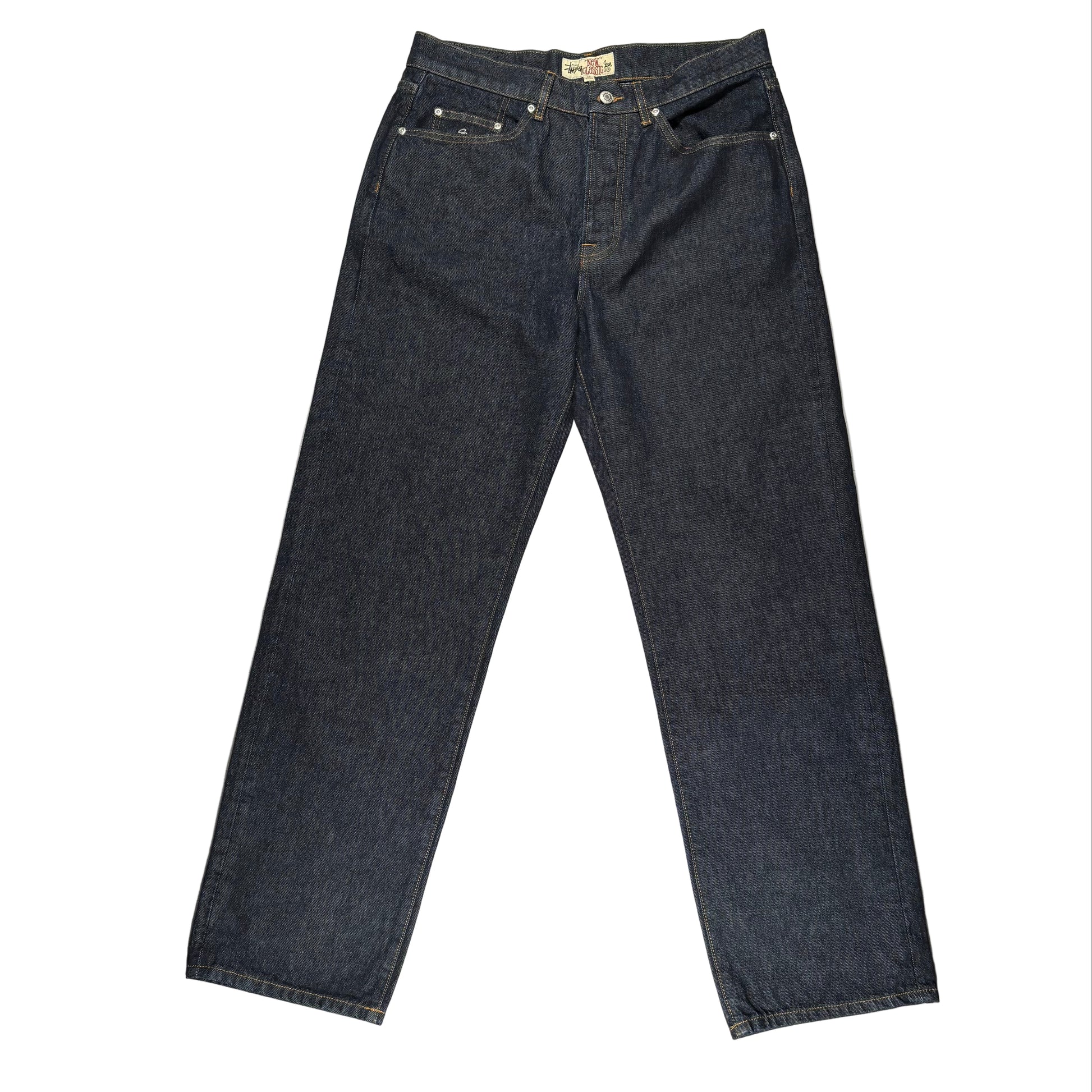 Pair of dark blue jeans on a white surface 