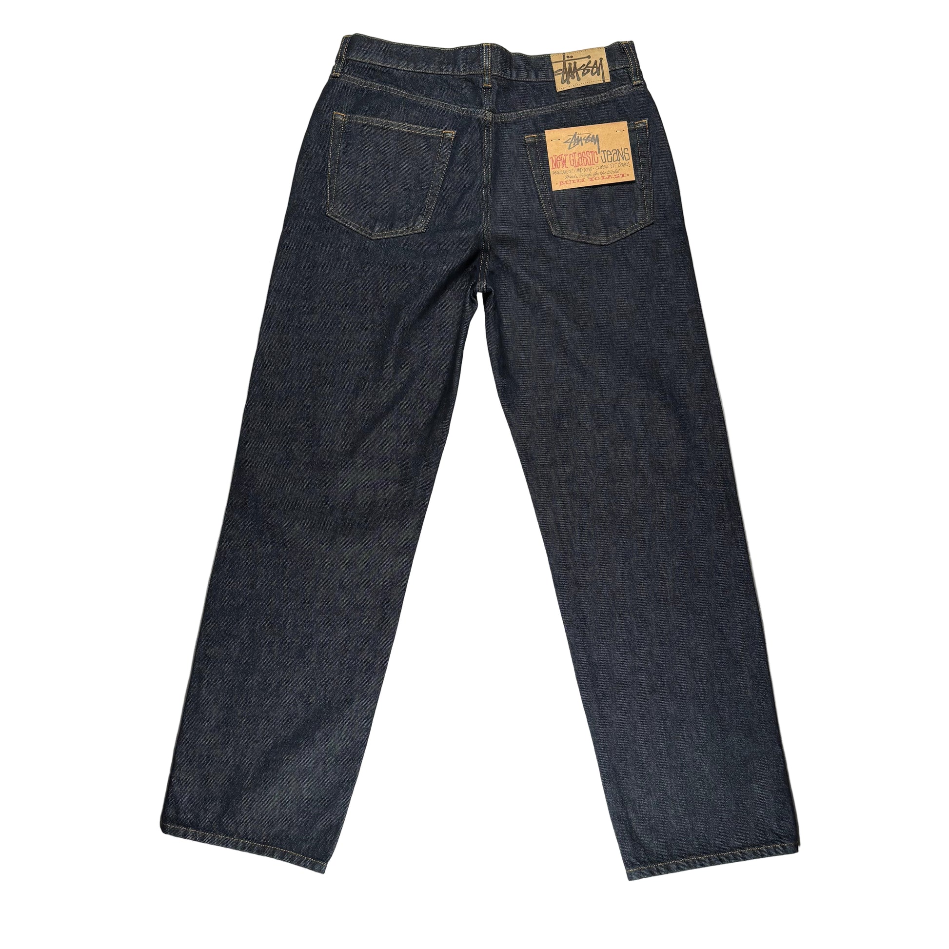 rear view of Dark blue jeans with a brand label on a white surface