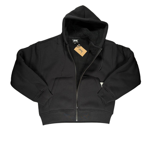 Black hoodie unzipped on a white surface