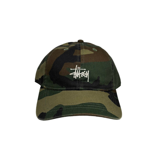 Camouflage baseball cap with a stussy logo on a white background