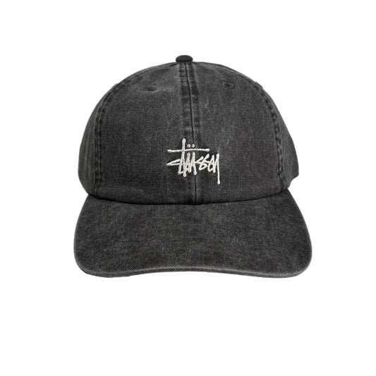 Black denim cap with a white logo on a white  background
