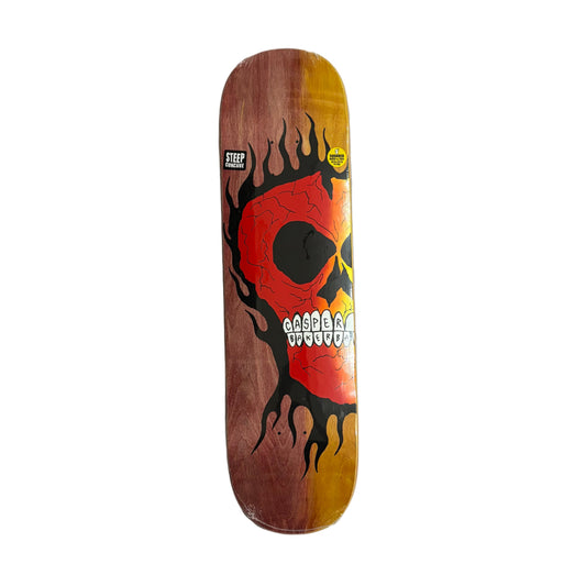 Skateboard deck with a skull design on a white surface