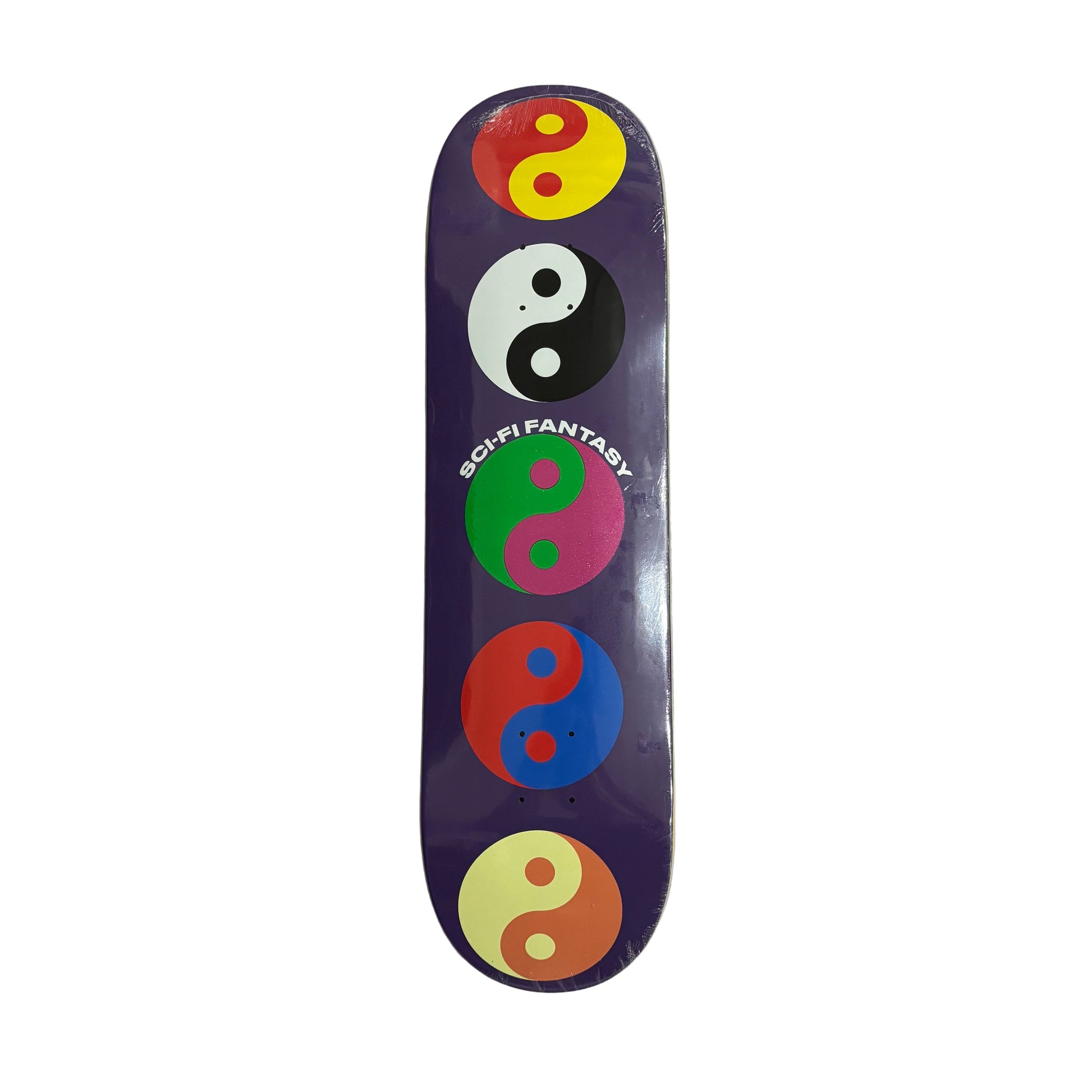 Skateboard deck with colorful yin yang symbols on a white surface