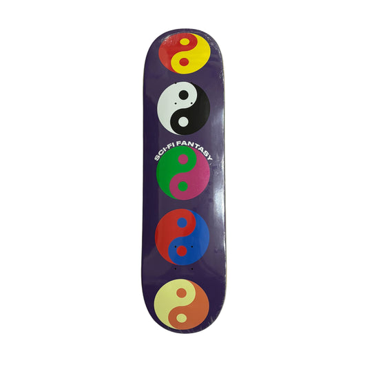 Skateboard deck with colorful yin yang symbols on a white surface