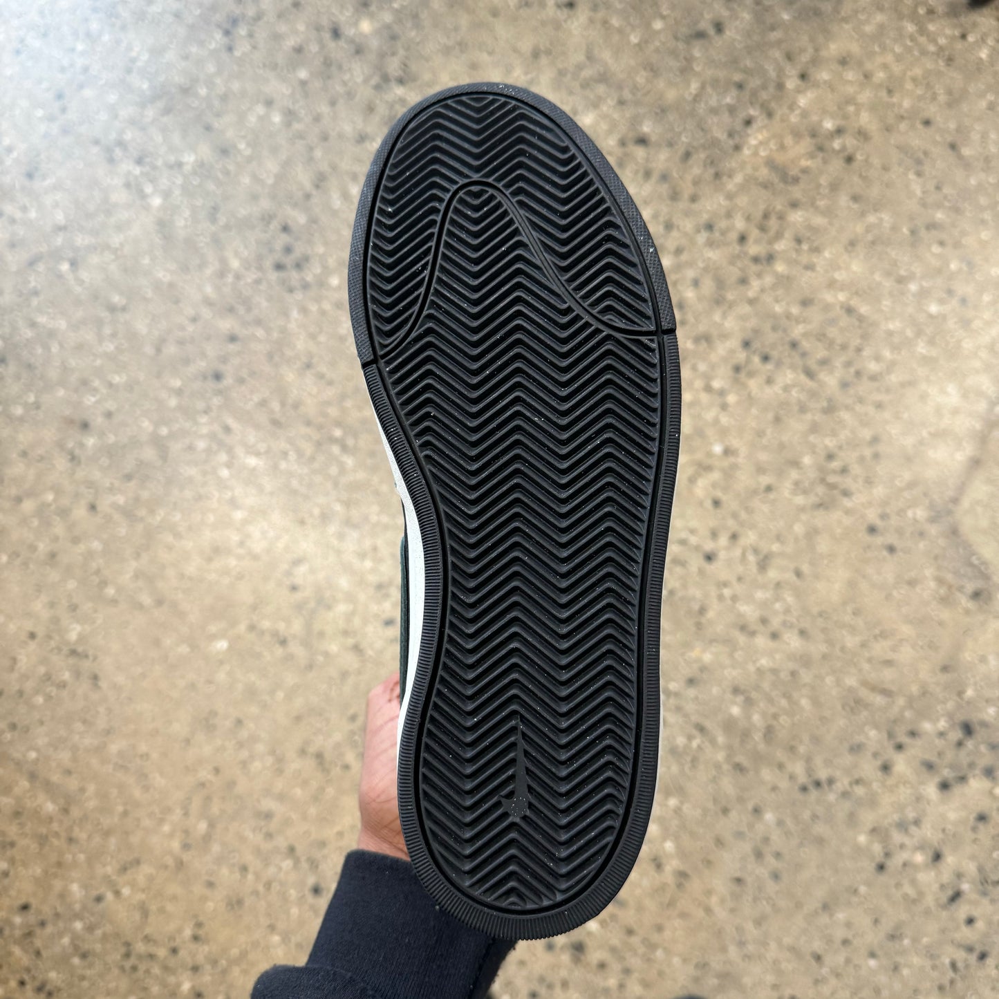 bottom of the shoe. black rubber sole