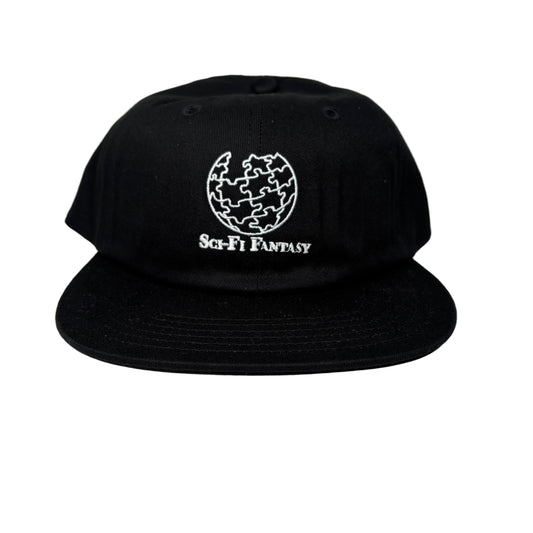 Black cap with white logo and text on a white surface