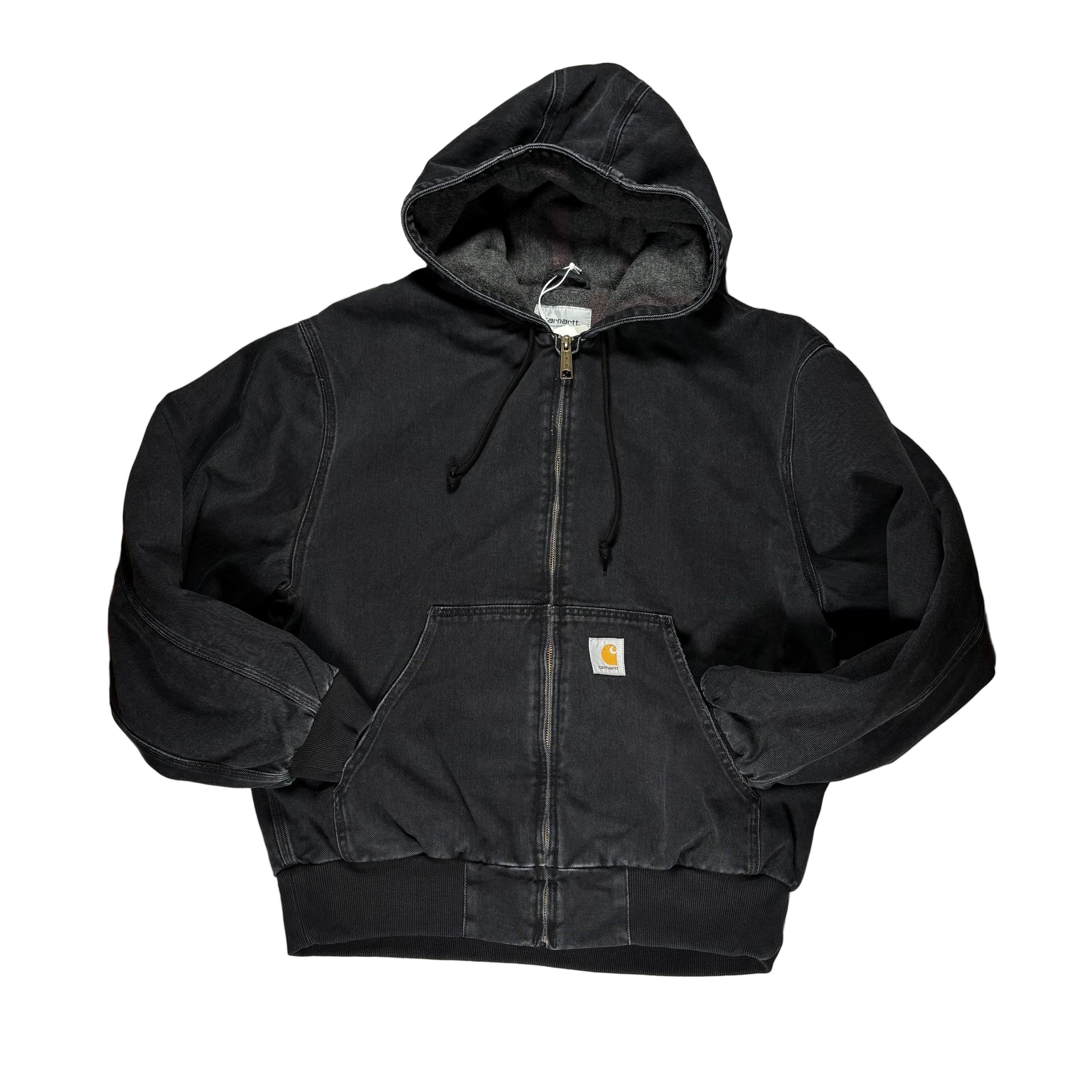 Black hooded work jacket on a white surface 