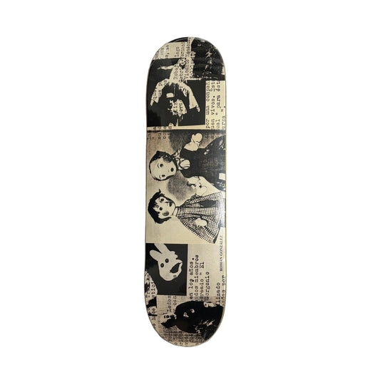 Skateboard deck with artistic design on a white surface