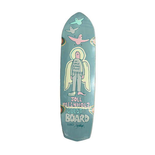 Skateboard deck with artwork and text on a white surface