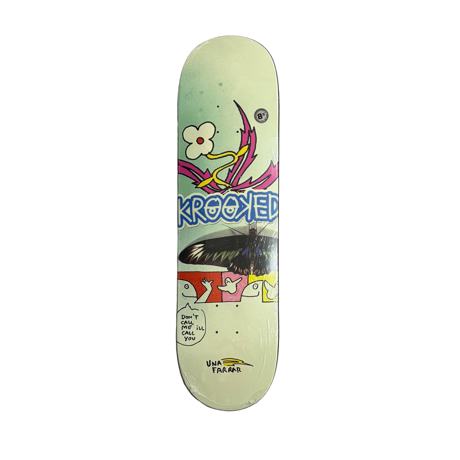 Skateboard deck with colorful design and 'Krooked' branding on a white surface.