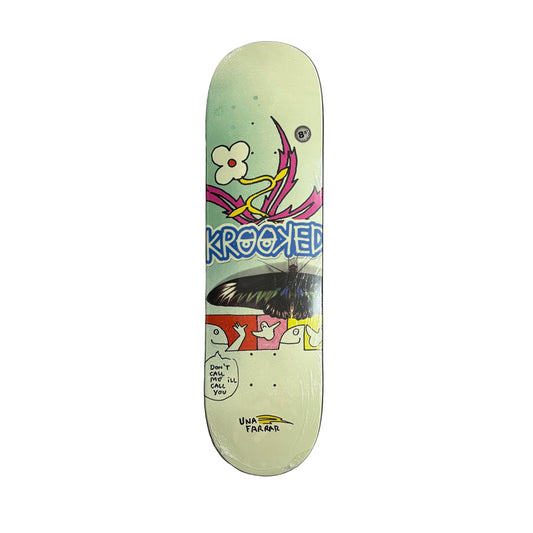 Skateboard deck with colorful design and 'Krooked' branding on a white surface.