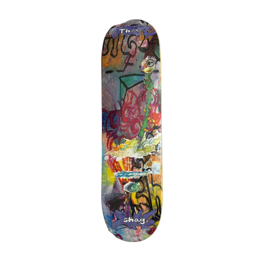 Colorful skateboard deck with abstract design on a white surface