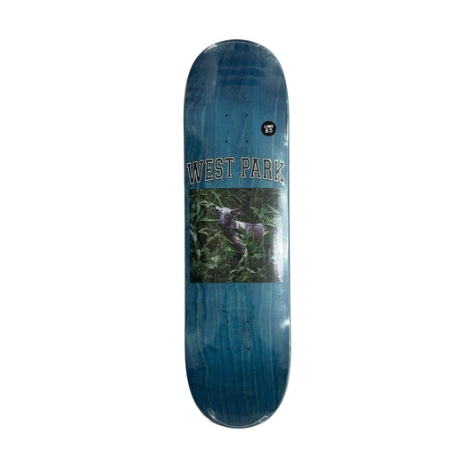Skateboard deck with 'West Park' branding on a white surface