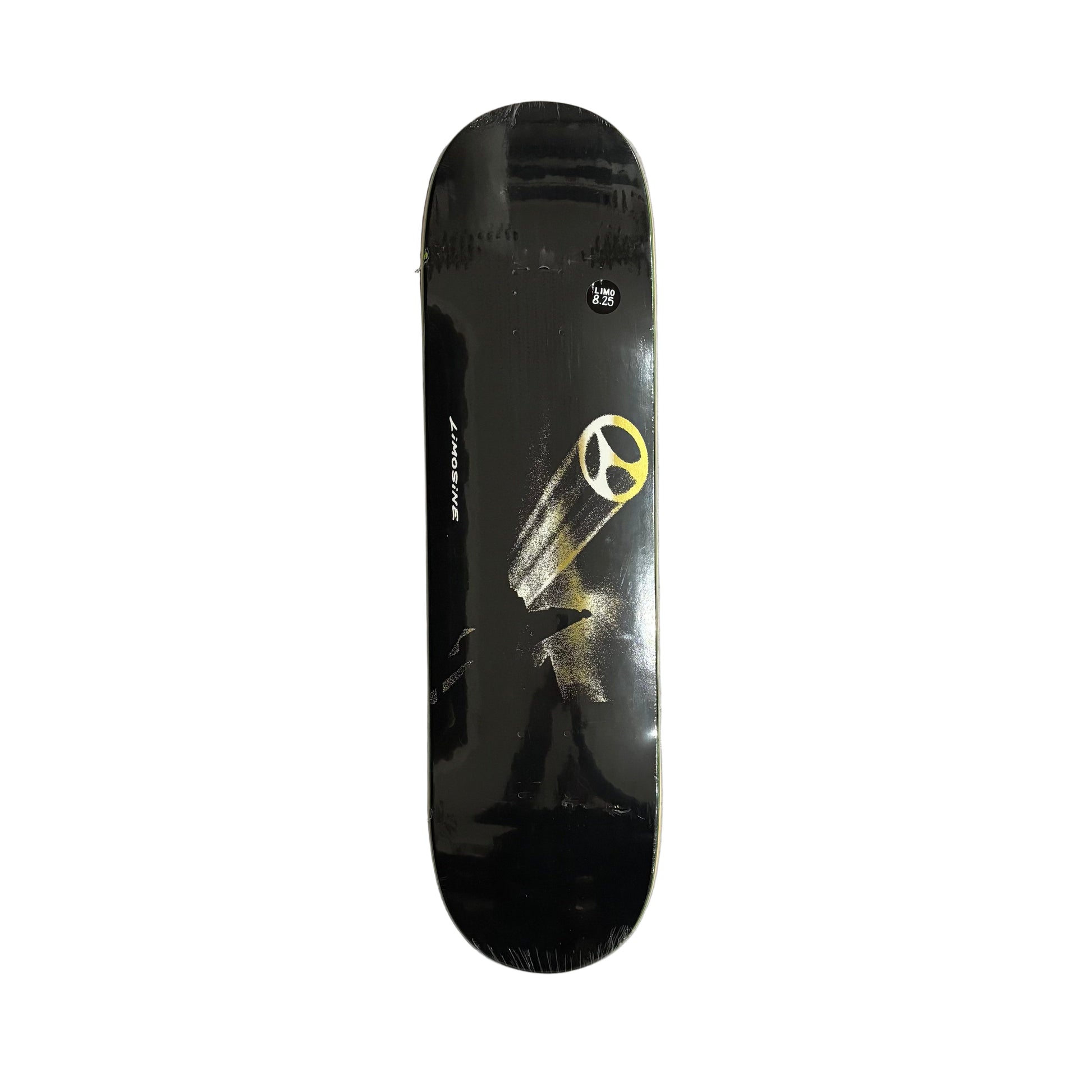 Black skateboard deck with a yellow logo on a white surface