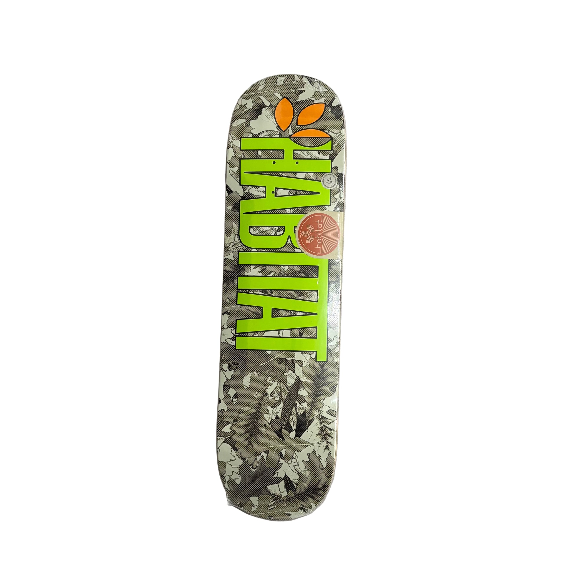 Skateboard deck with 'Habitat' branding on a white surface