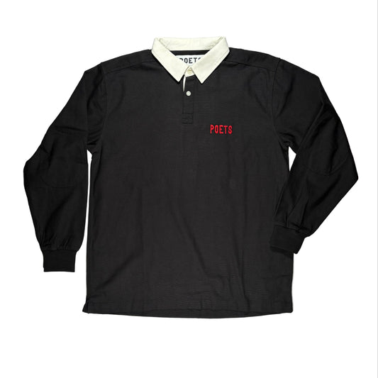 Black long-sleeve rugby shirt with white collar and red logo on a white surface