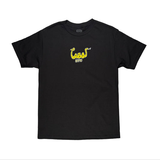 Black t-shirt with yellow snake design on a white surface