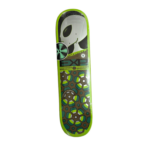 Skateboard deck with green and black design on a white surface