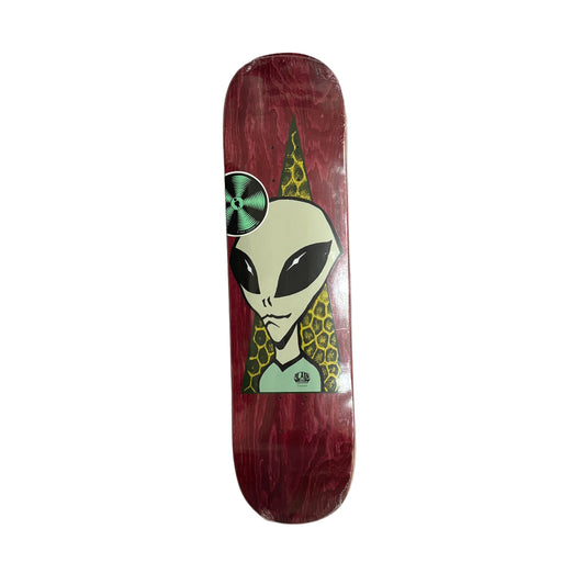 Skateboard deck with alien design on a white surface