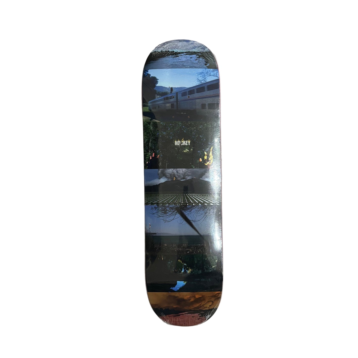Skateboard deck with a mulit color photo graphic on a white background