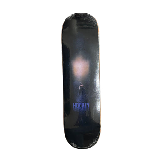 Black skateboard deck with a hockey brand logo on a white surface.